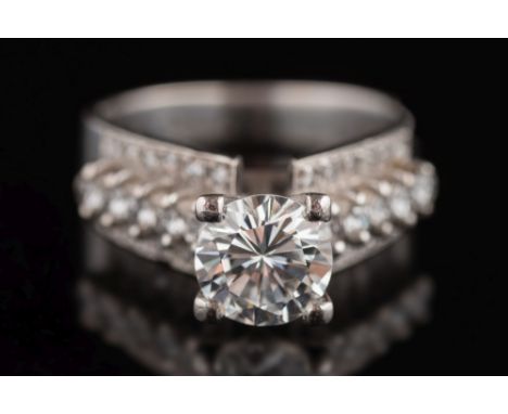 A diamond single-stone ring: the circular, brilliant-cut diamond approximately 7.2mm diameter, estimated to weigh approximate