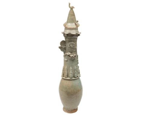 A Chinese celadon glazed funerary jar and a cover: of ovoid form, the long tapering neck applied with a dragon and attendant 