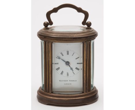 Matthew Norman, a modern small French oval carriage clock: the eight-day duration timepiece movement having a platform lever 