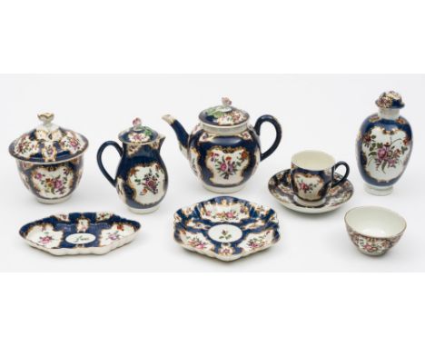 A Worcester (First Period) part tea and coffee service: painted with floral sprays within gilt scrollwork cartouches reserved