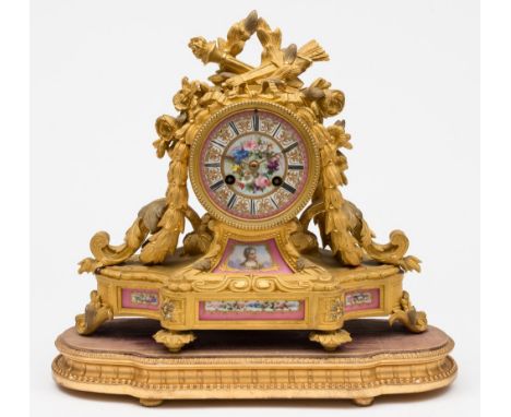 A French ormolu and porcelain mantel clock: the eight-day duration movement striking the hours and half-hours on a bell with 