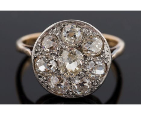 A diamond circular cluster ring: pave-set with eight round old brilliant-cut diamonds estimated to weigh a total of 1.5cts, r