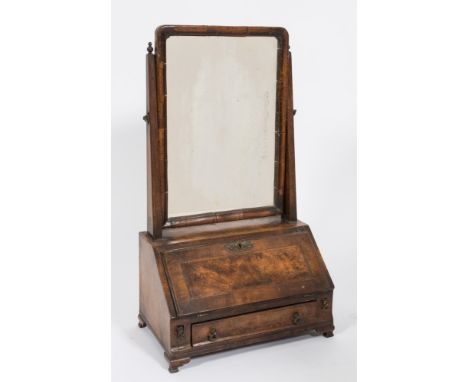 An 18th Century walnut and crossbanded swing frame toilet mirror:, the plate within a moulded surround, having later uprights