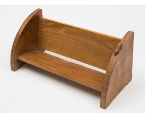 By Robert Thompson of Kilburn 'The Mouseman' oak book trough: of rectangular outline, on curved end supports, 45cm. wide.