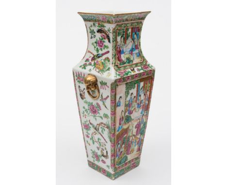 A Canton porcelain vase: of shouldered square profile with lion mask and ring handles, decorated front and verso with panels 