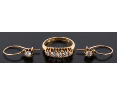 A late 19th century gold and diamond five-stone ring: with graduated cushion-shaped old brilliant-cut diamonds estimated to w