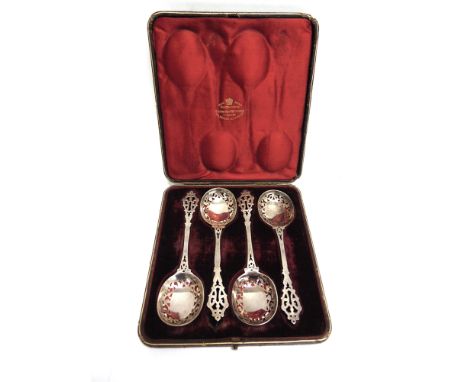 A CASED SET OF FOUR LATE VISTORIAN SILVER SERVNG SPOONS  by Gibson & Langman, London 1892, with pierced bowls and finial, 19c