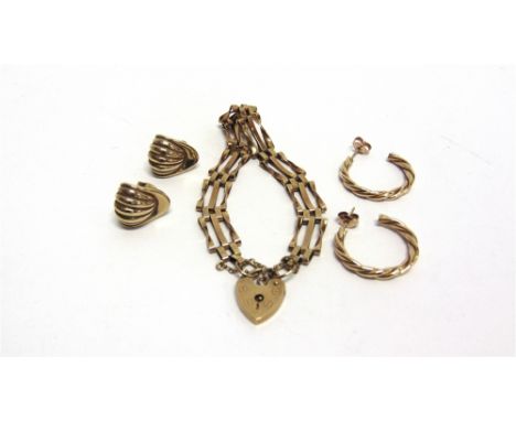A PAIR OF 9 CARAT GOLD SHELL LIKE EARSTUDS a pair of 9 carat gold barley twist hoop earrings; and a 9 carat gold three bar ga