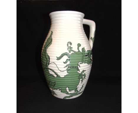 A LARGE 1930S ENGLISH POTTERY JUG  of ribbed design, painted decoration of a dragon, impressed to base 'G JONES' and 'F W R P