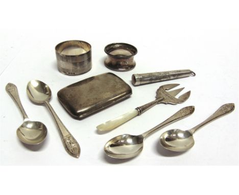 A SILVER NAPKIN RING another silver napkin ring; four silver tea spoons; a silver cigarette case; a silver cheroot holder cas