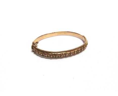 A LATE VICTORIAN 15 CARAT GOLD HINGED BANGLE  hallmarks worn, 0.8cm wide, internal diameter 6.1cm, 10g gross