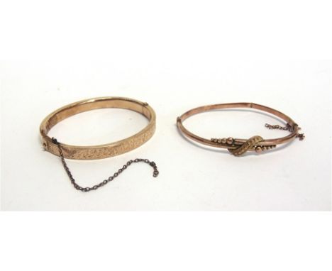 A HALF ENGRAVED HINGED BANGLE  stamped '15' to the catch, 6mm wide, internal diameter 5.7cm, 10g gross; with a 9 carat gold h