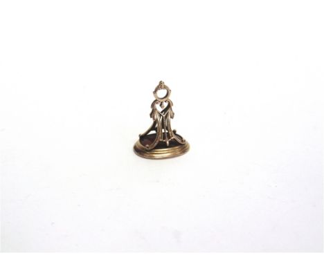 AN EARLY 19TH CENTURY SEAL FOB  unmarked, the oval carnelian carved with an intaglio of the profile of a young classical male