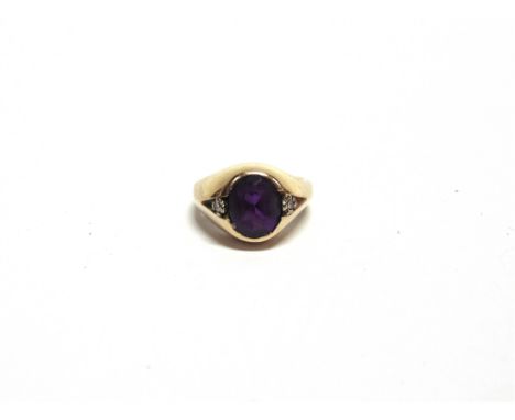 AN AMETHYST RING stamped '9ct', with a single cut diamond to each shoulder, finger size G, 5.5g gross