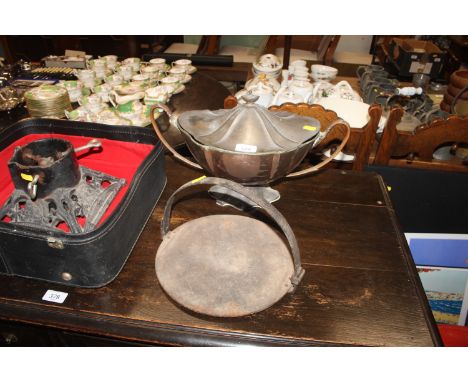 A plated soup tureen; an iron skillet and a cast iron based Christmas tree stand 