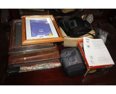 An Agfa Isolar camera; a Panasonic digital camera; a Polaroid camera, albums and photo frames etc.