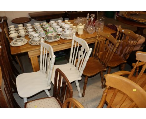 A pair of elm seated kitchen stick back chairs and a pair of painted similar 