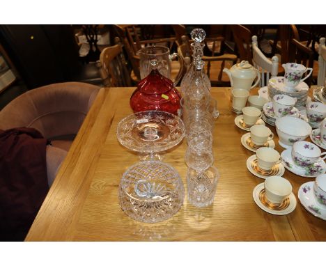 A quantity of various cut table glassware; a ruby glass jar and cover; decanters etc.