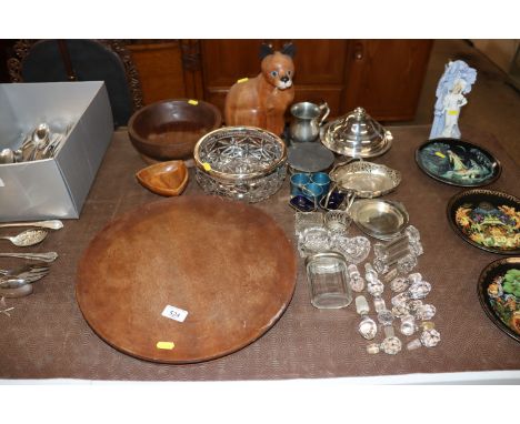 A large wooden platter; a wooden model of a cat; fruit bowl; a quantity of plated ware; glass decanter stoppers etc. 