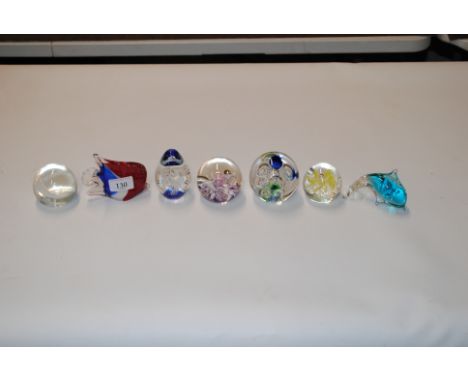 Seven glass paperweights to include Caithness and Selkirk
