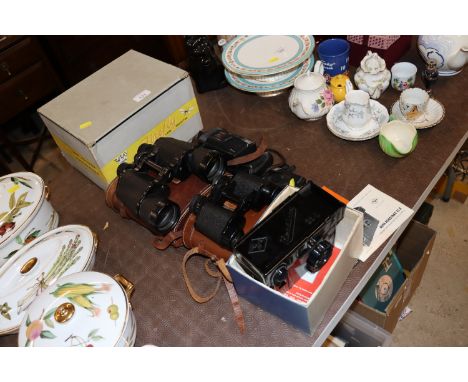 A Fire Fly projector; two pairs of cased binoculars; a Rogermax camera etc. 