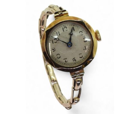 An 18ct gold ladies vintage watch head with a 9ct gold expanding strap, weight all together including mechanism Condition Rep