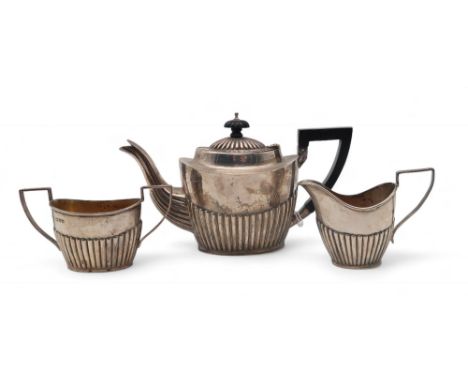 A late-Victorian bachelor's silver tea service,&nbsp;John Millward Banks, Chester 1899, the bodies fluted, with reeded handle