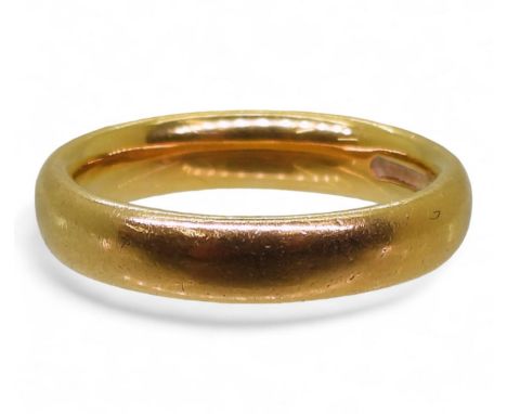 A 22ct gold court wedding ring, hallmarked London 1917, size K1/2, weight 6.4gms Condition Report:Available upon request