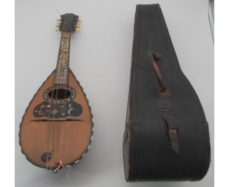A Napoli bowl back mandolin with unusual and striking full mother of pearl finger board and inlaid tortoise shell scratch pla