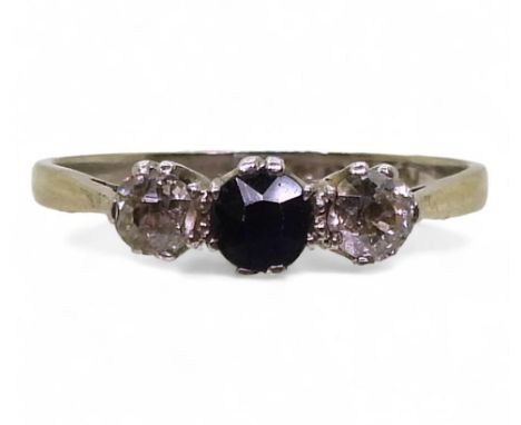 An 18ct white gold and platinum sapphire and diamond ring, set with two old cut diamonds of estimated approx 0.25cts together