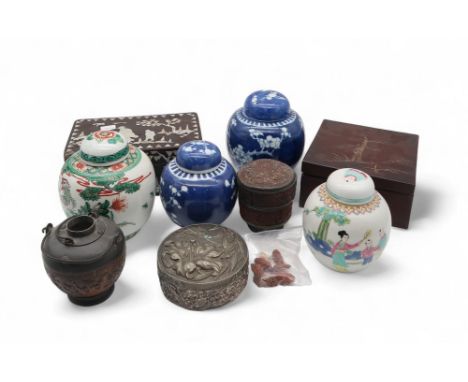 A collection of oriental ceramics including two Chinese prunus pattern blue and white ginger jars, a Famille verte ginger jar
