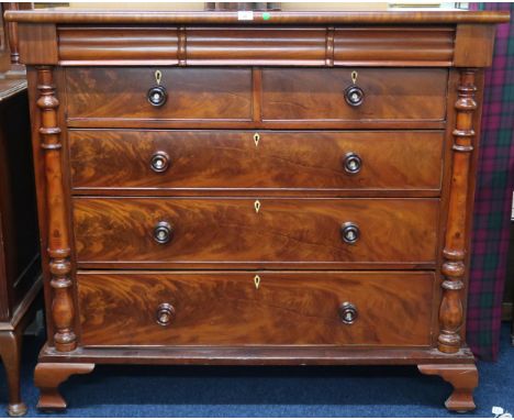 A late Victorian mahogany Scotch style chest of drawers with three short frieze over two short over three drawers on bracket 