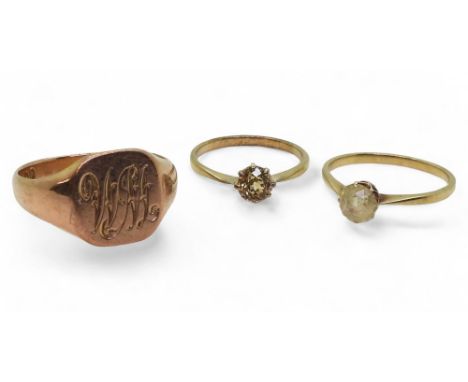A 9ct gold signet ring, size X, together with two clear gem set rings, brown, size M, pale yellow size P, weight all together