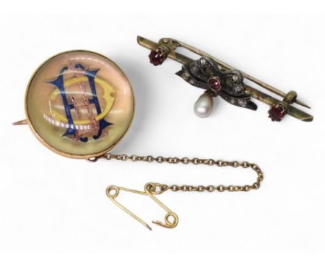 A yellow metal diamond, red gem and pearl brooch, together with an Essex crystal style monogram brooch, weight together 11.7g