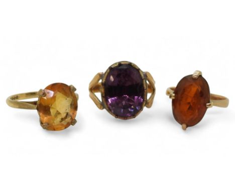 A 9ct gold citrine set ring, size N, together with two yellow metal rings, weight all together 10gms Condition Report:Availab