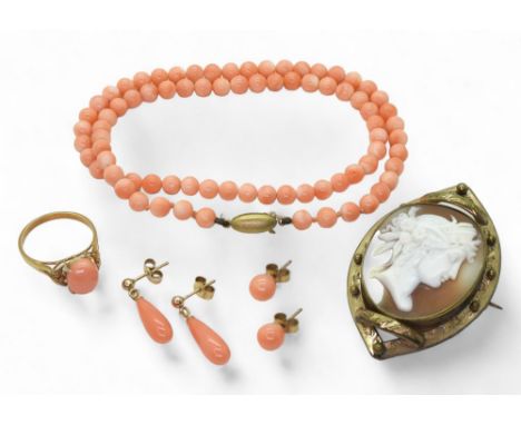 A string of coral beads with a 9ct gold Mikimoto clasp, two pairs of 9ct mounted coral earrings, weight together, 20.1gms a g