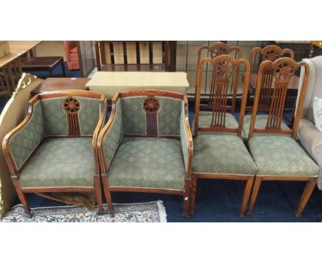 A Victorian part parlour suite consisting a pair of mahogany and satinwood inlaid armchairs and a set of four accompanying hi