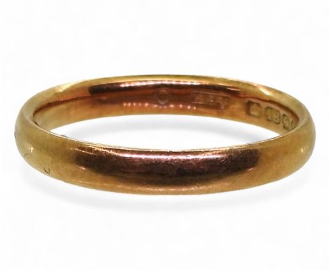 An 18ct gold wedding ring, dated Birmingham 1921, size O1/2, weight 3.3gms Condition Report:Available upon request