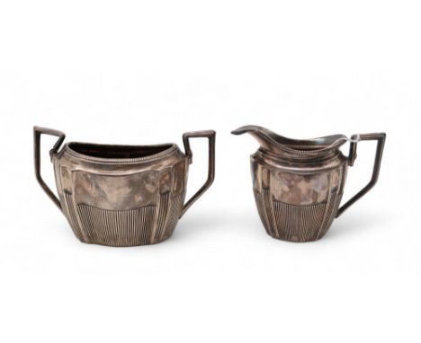 A matched part silver tea service, maker's mark A B, Birmingham 1893, the bodies lobed and with reeded decoration, 189gms (2)