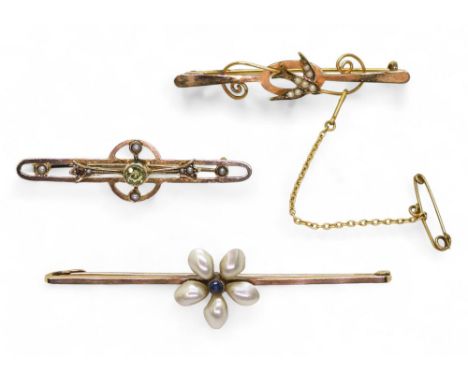 A 9ct gold sapphire and mother of pearl flower brooch, length 6.4cm, a 9ct peridot brooch and a 9ct swallow brooch, weight to