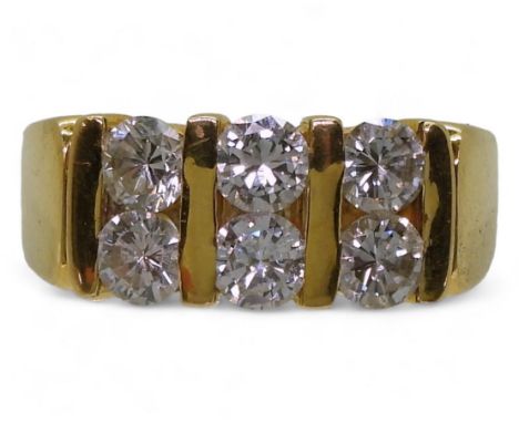 A bright yellow metal ring, stamped 90%, set with six diamonds with a combined diamond total of estimated approx 1.20cts, fin