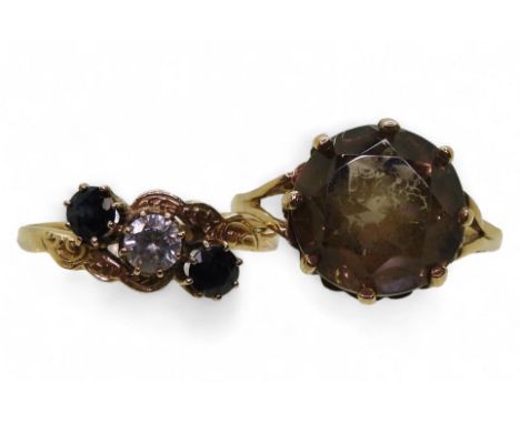 A 9ct gold sapphire and clear gem set ring, size P1/2, together with a 9ct gold smokey quartz ring, size Q1/2, weight togethe
