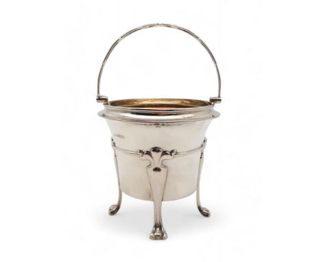 An Art Nouveau silver sugar basket, by William Hutton &amp; Sons, Sheffield 1905, with a stylised carrying handle, on four st
