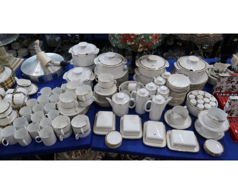A large collection of Thomas gold rimmed tablewares including soup tureens, tureens, plates, bowls, butterdishes, pepper pots