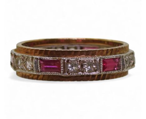 A 9ct gold eternity ring set with pink and clear gems, size O1/2, weight 3.6gms Condition Report:Available upon request