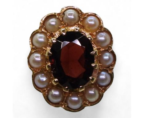 A 9ct gold garnet and pearl ring, size P1/2, weight 3.8gms Condition Report:Available upon request