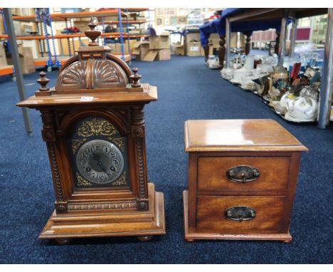 A mahogany mantle clock and a two drawer cabinet Condition Report:No condition report available.