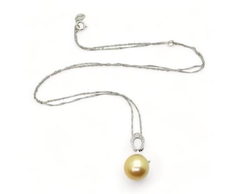 An 18ct white gold golden South sea pearl pendant further set with diamond accents and on a 18ct white gold Italian made rope
