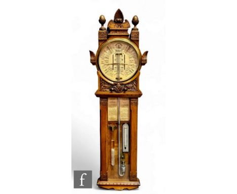 A late 19th century Improved Admiral Fitzroy barometer in carved oak cased with printed circular scale incorporating thermome