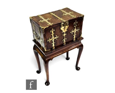 A late 18th to early 19th Century two handled rosewood chest on stand, fitted interior with hinged fall front and button rele